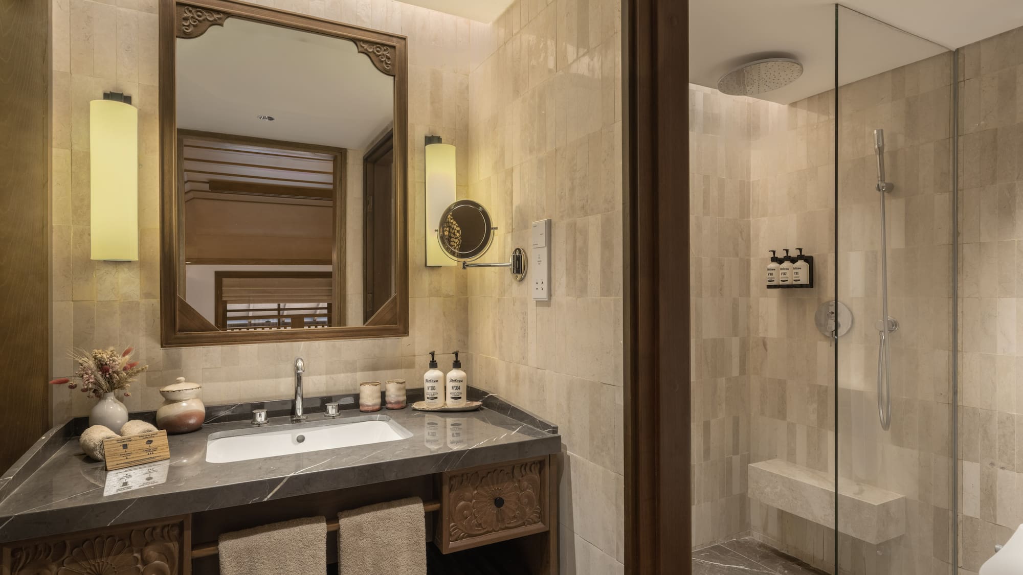 a bathroom with a mirror and a shower