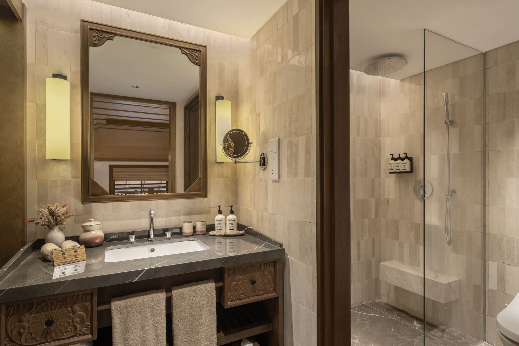 a bathroom with a mirror and a shower