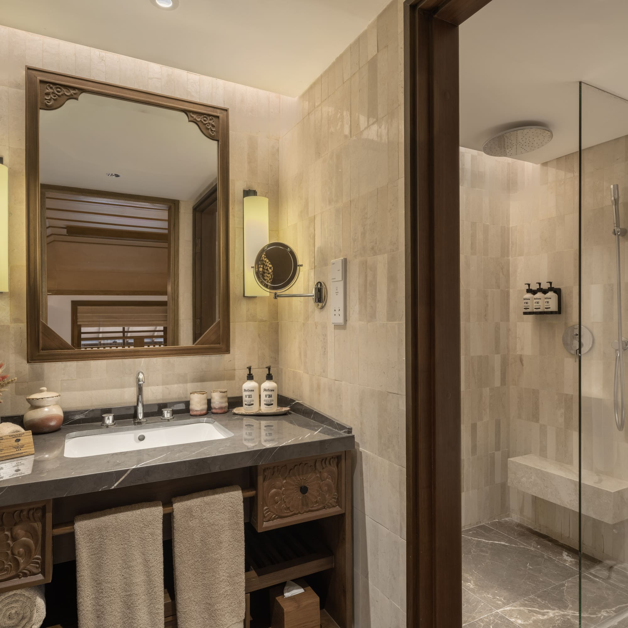 a bathroom with a mirror and a shower