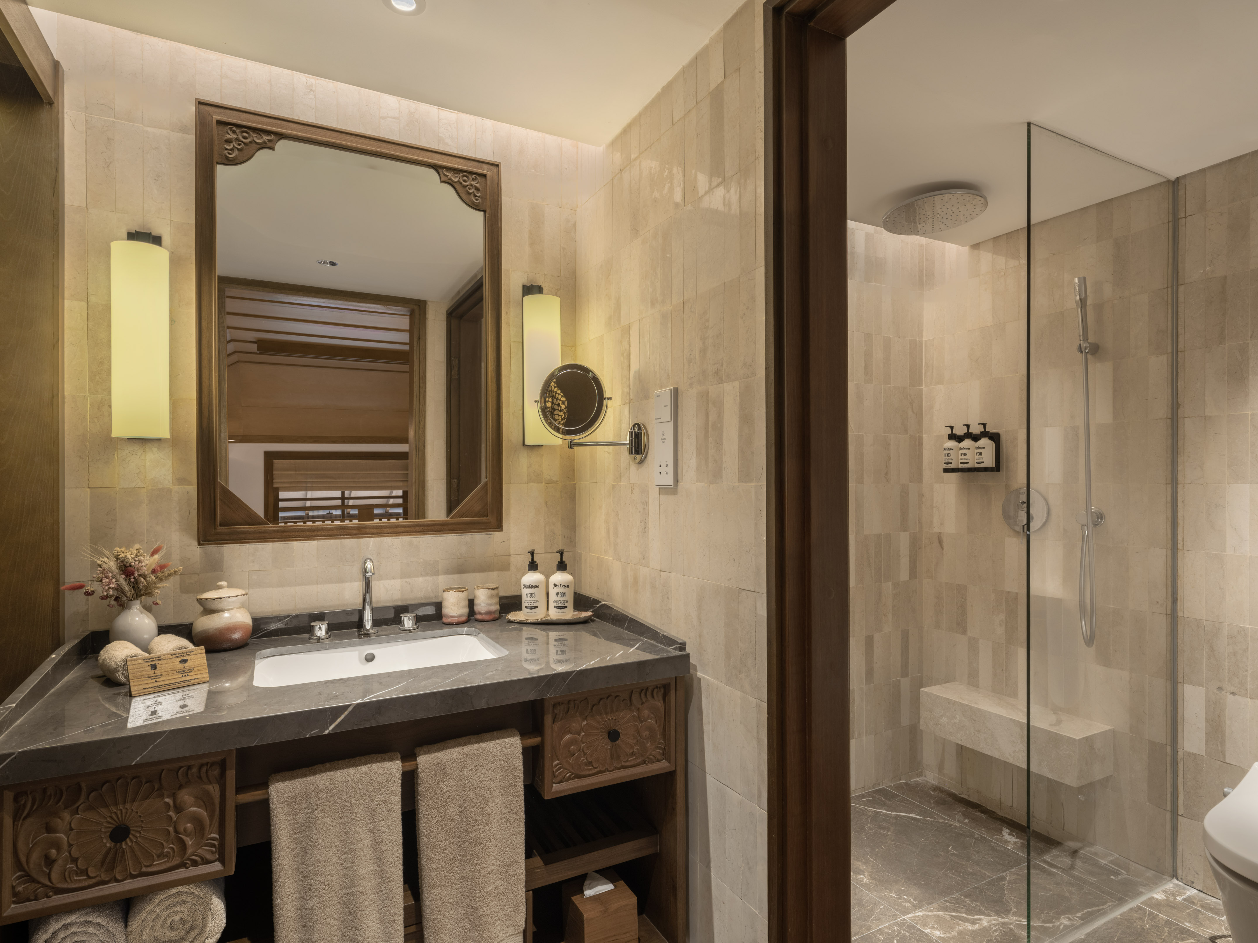 a bathroom with a mirror and a shower