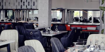 a restaurant with tables and chairs