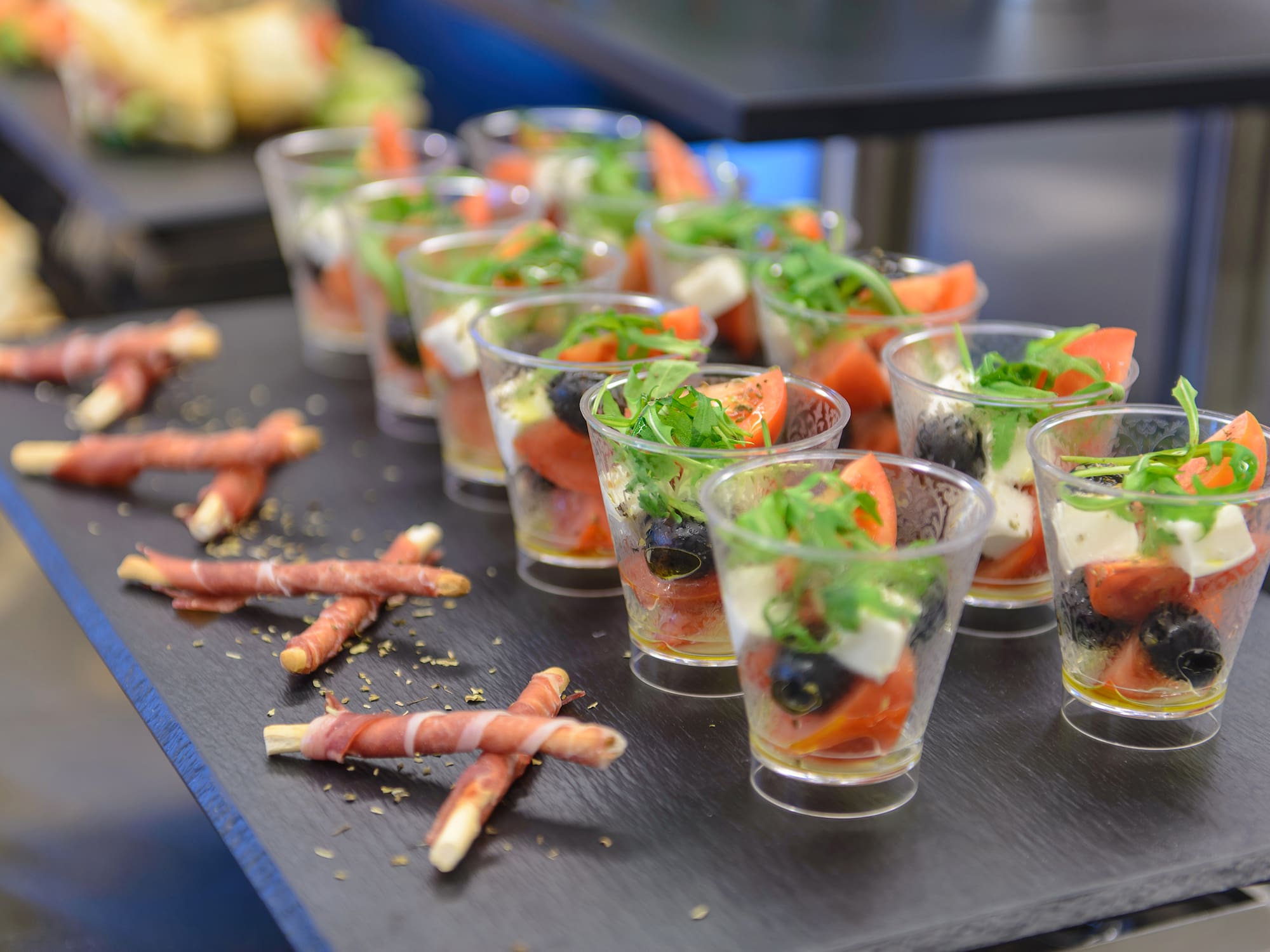 a tray of small glasses of food
