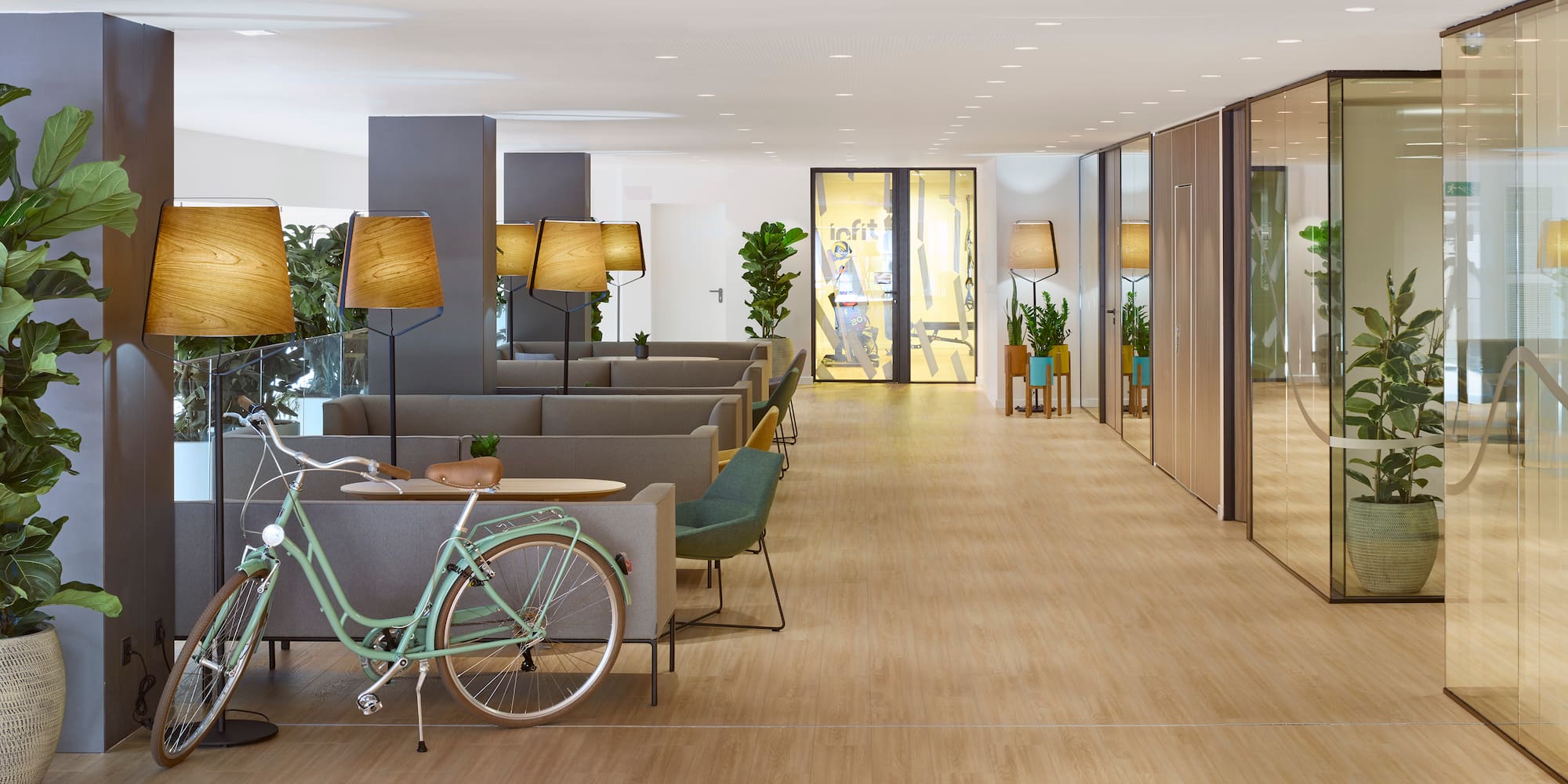 a room with a bicycle and chairs