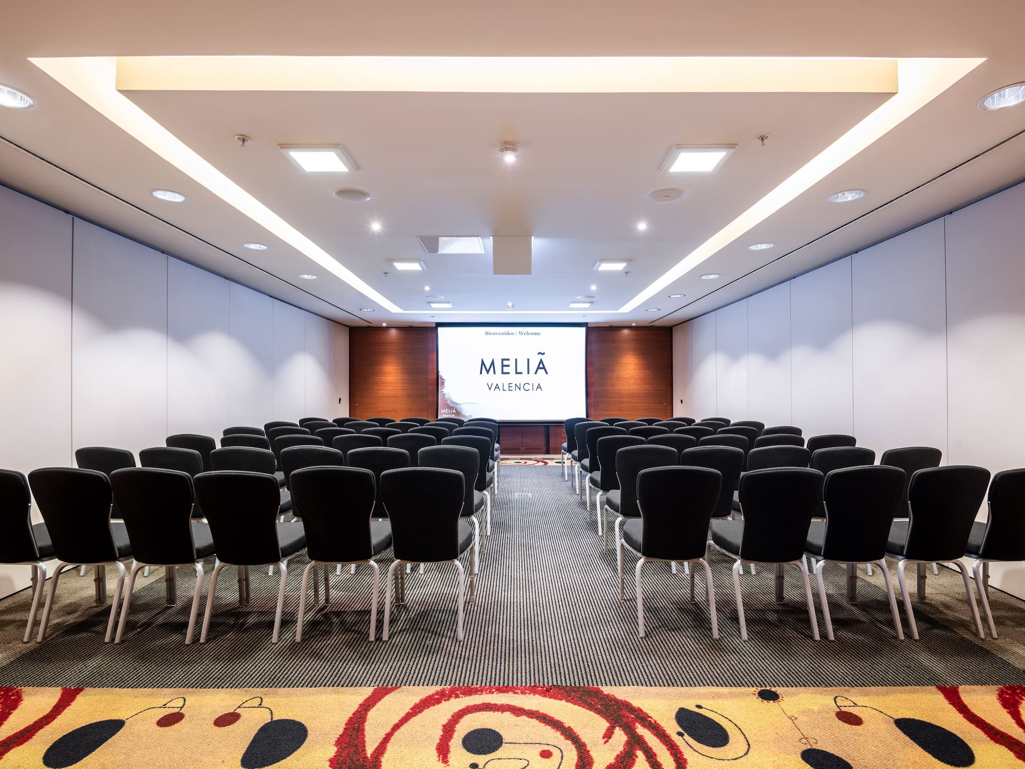 a room with rows of chairs