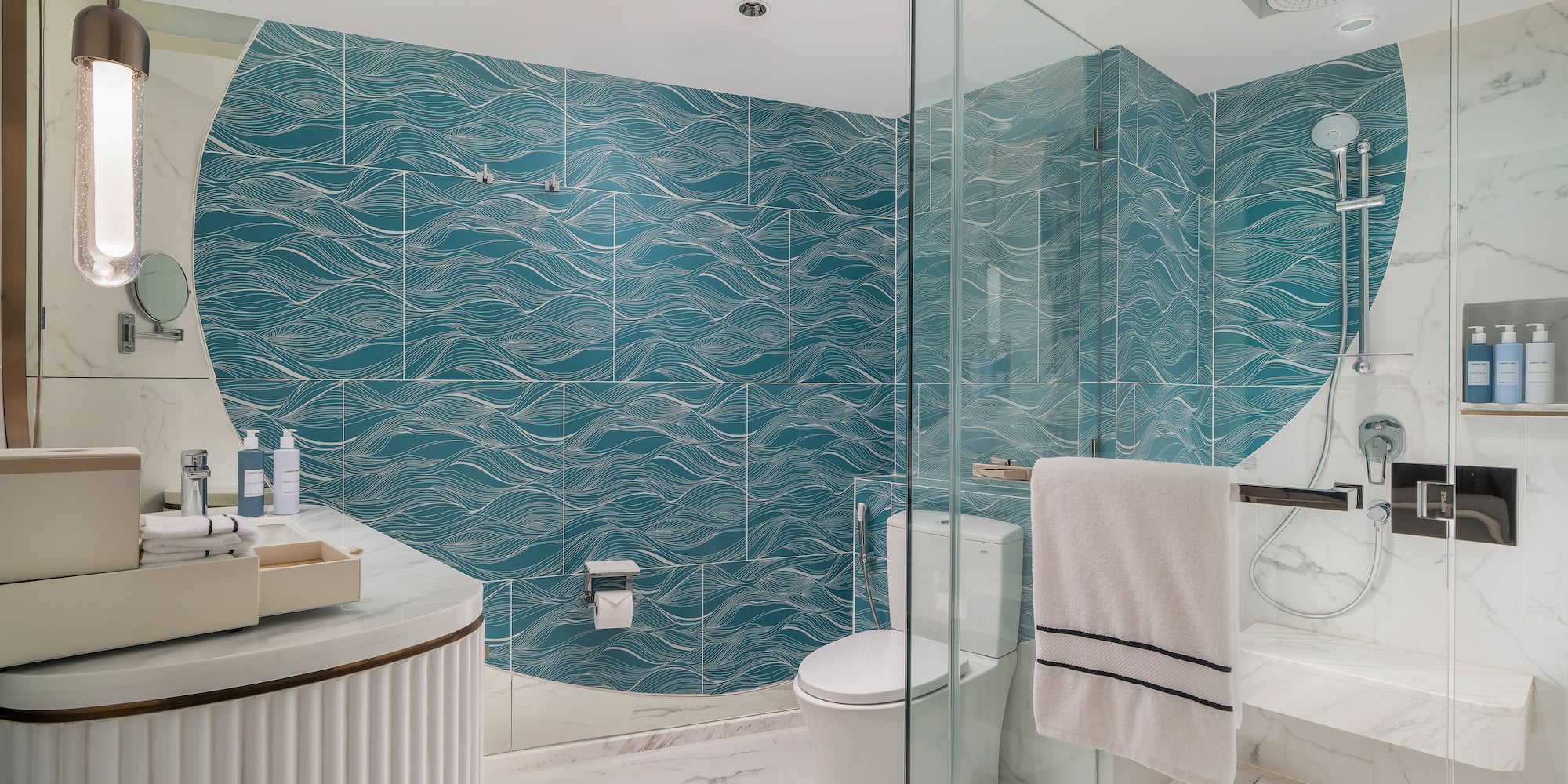 a bathroom with a blue wall and a toilet
