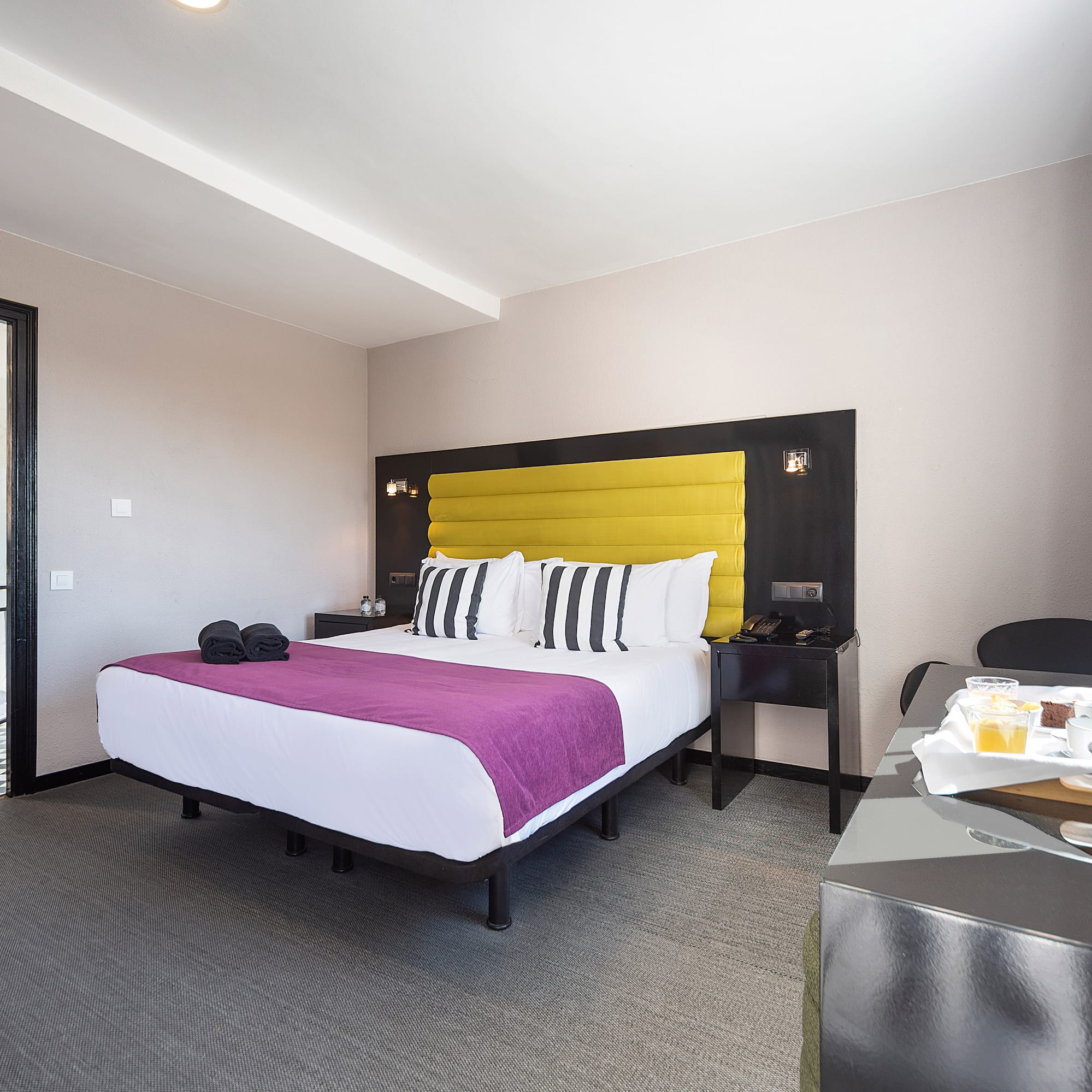 a room with a bed and a table