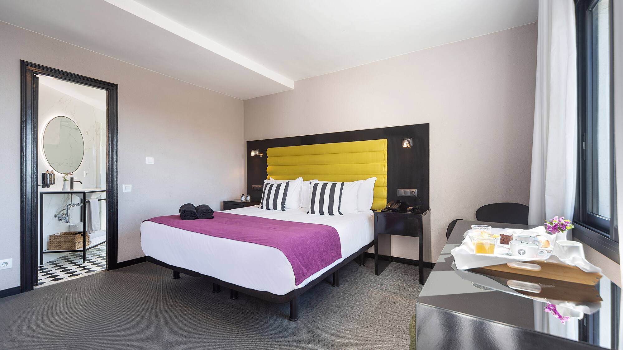 a room with a bed and a table