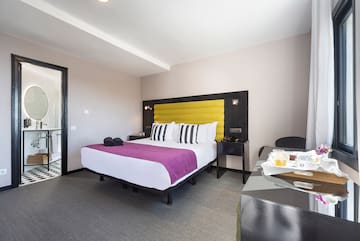 a room with a bed and a table