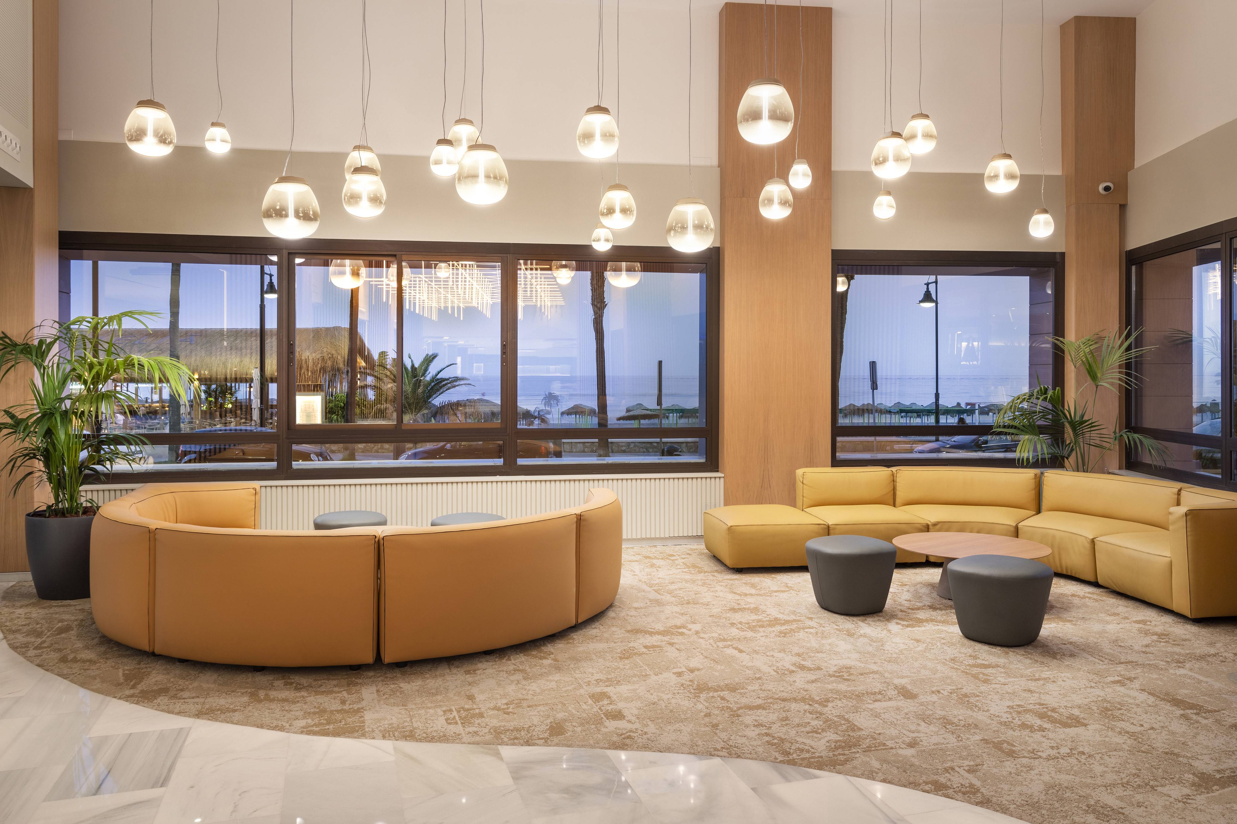 a room with couches and tables