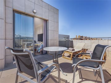 a patio with chairs and a table