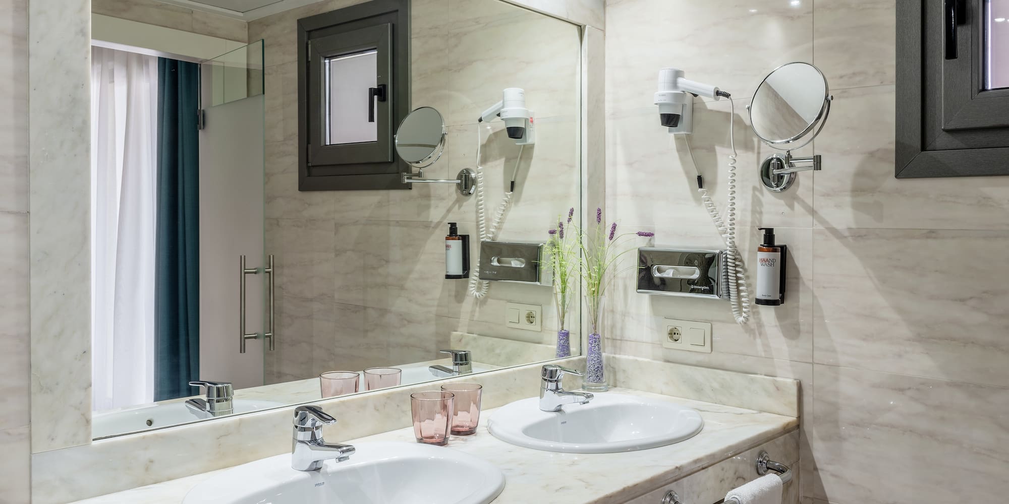 a bathroom with a mirror and sinks
