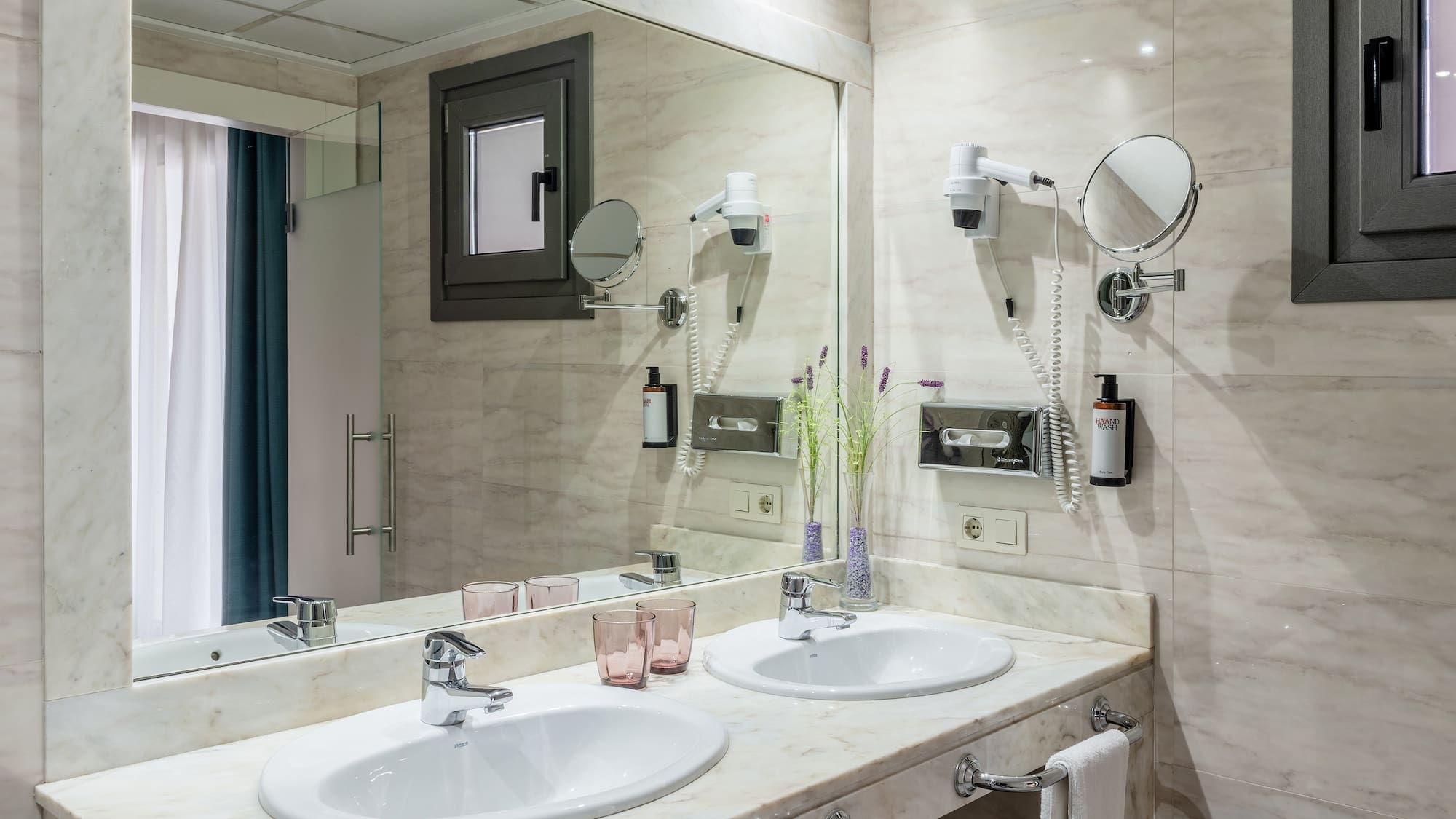 a bathroom with a mirror and sinks