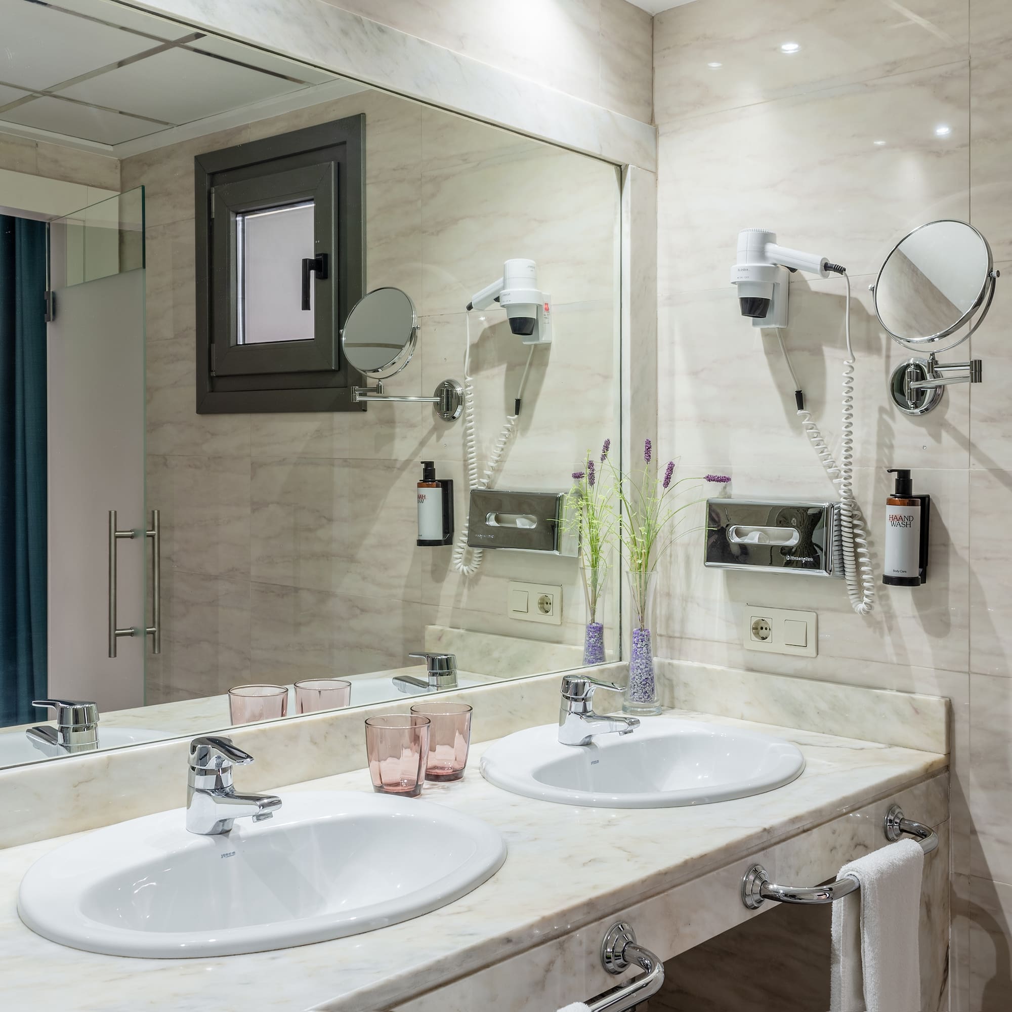 a bathroom with a mirror and sinks