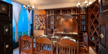 a dining room with a table and chairs
