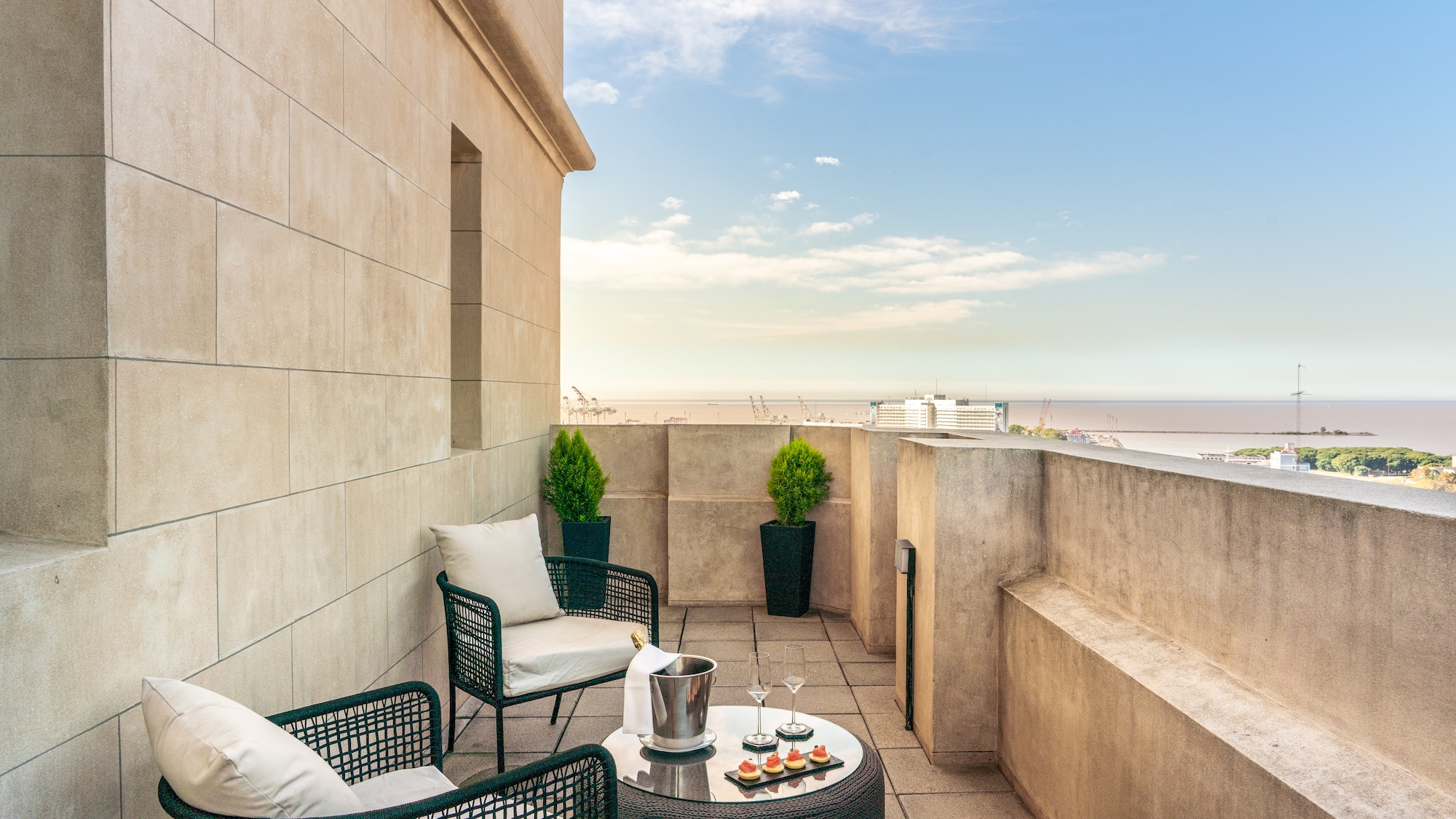 a patio with chairs and a table