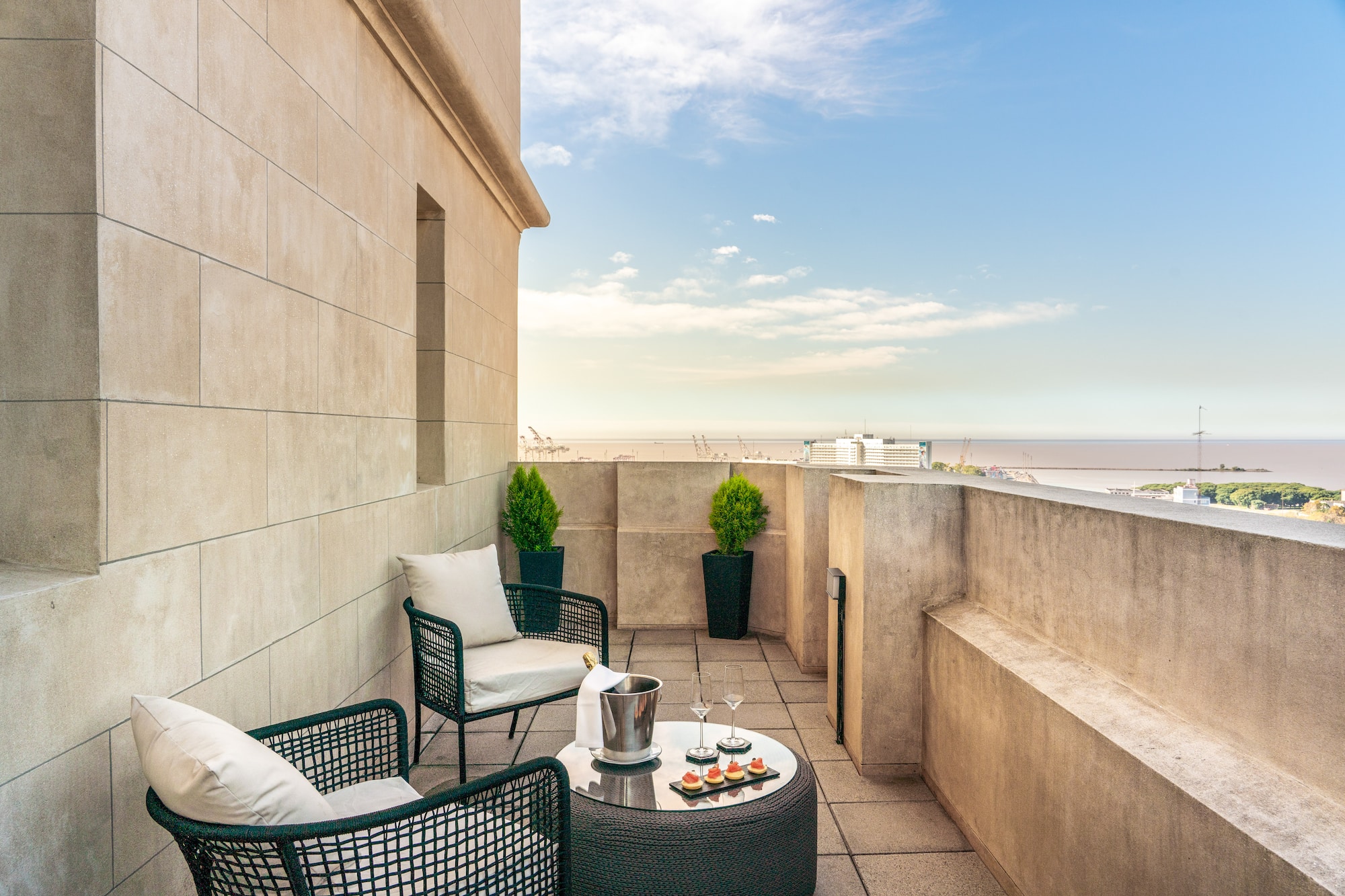a patio with chairs and a table