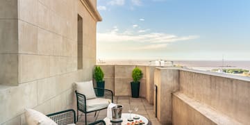 a patio with chairs and a table