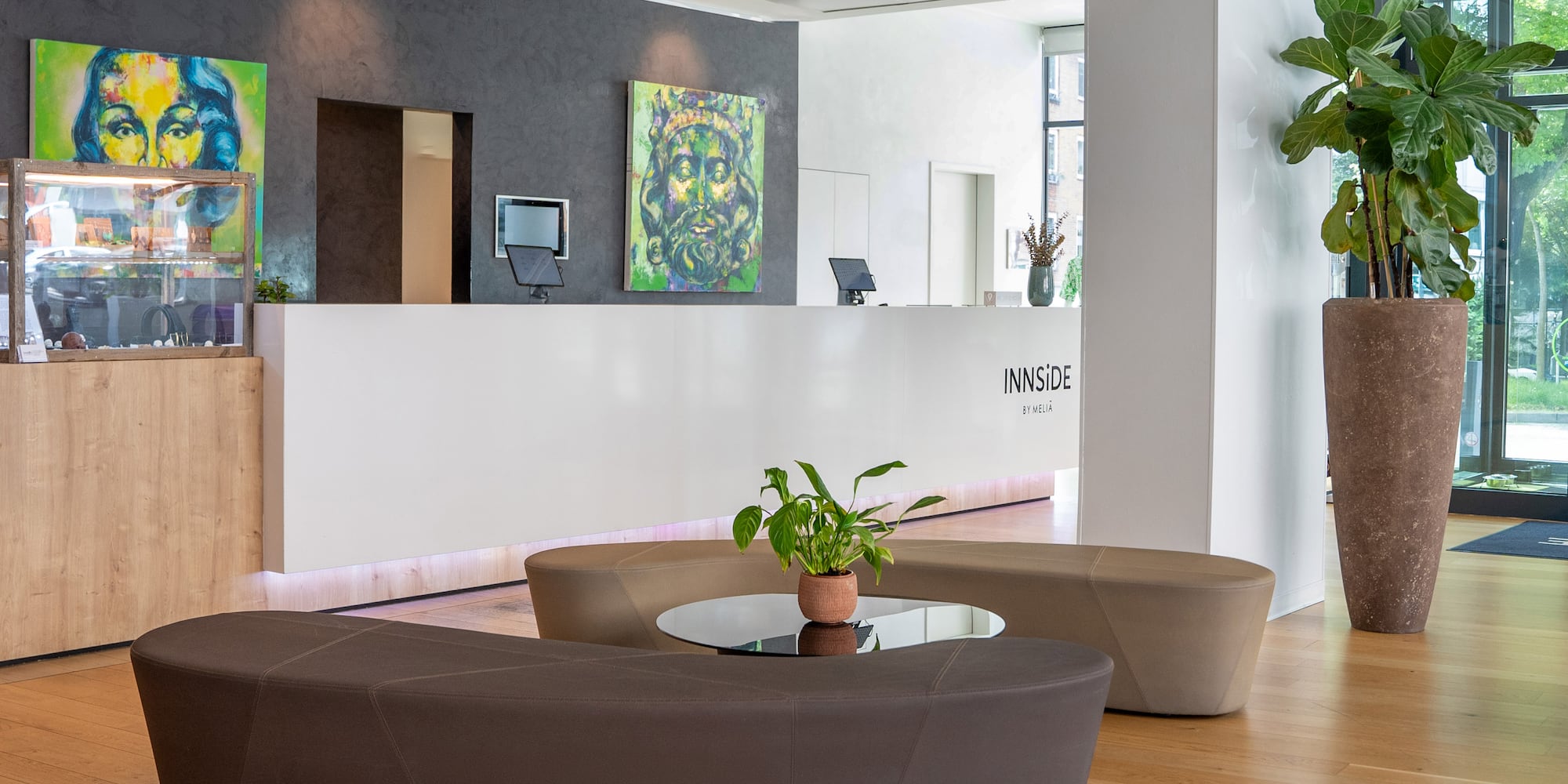 a lobby with a table and chairs