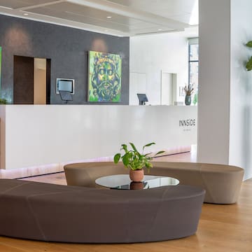 a lobby with a table and chairs