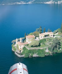 a house on an island surrounded by water