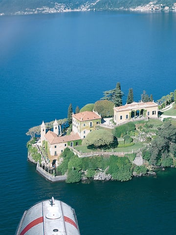 a house on an island surrounded by water