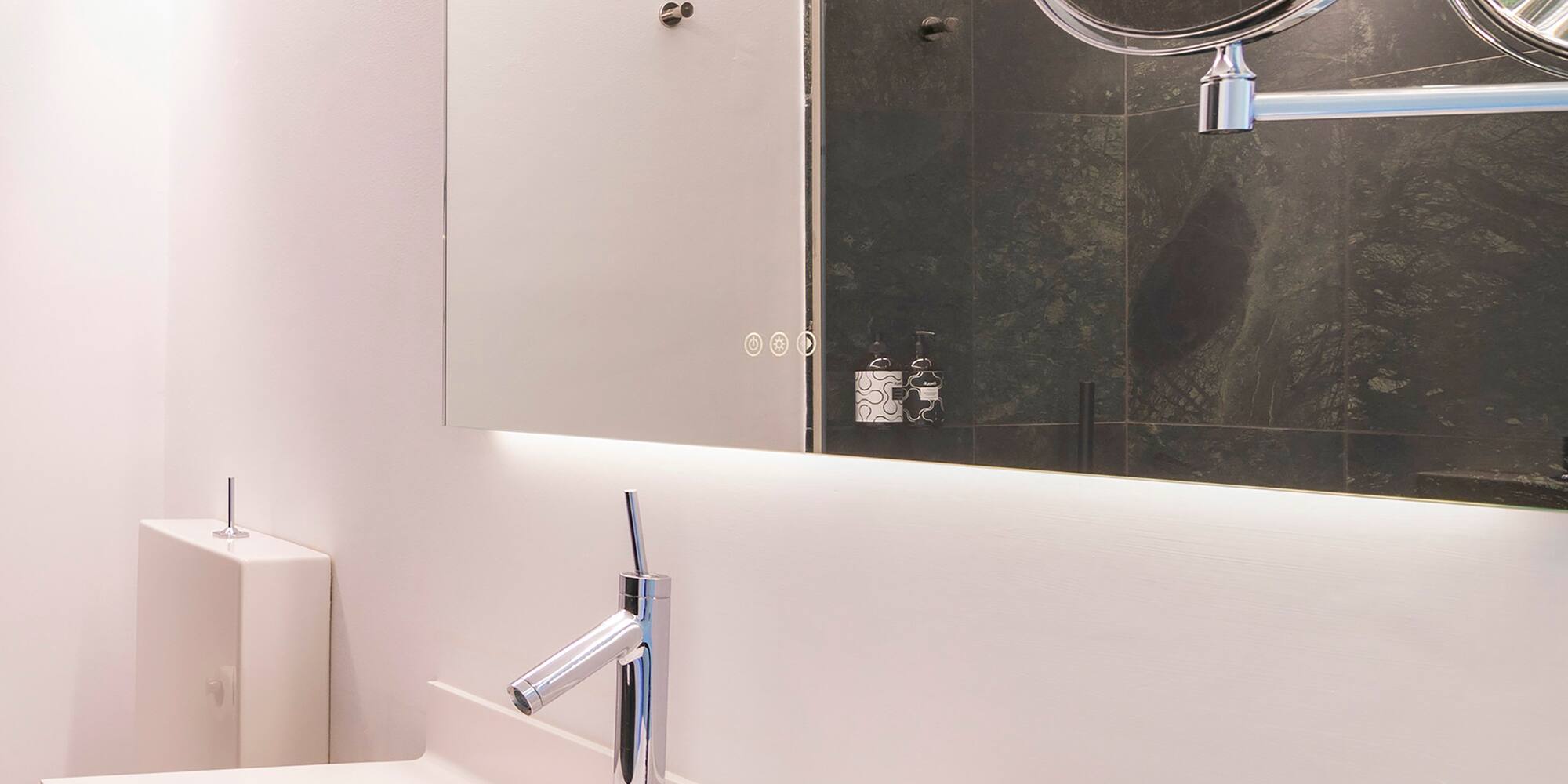 a bathroom with a mirror and a sink