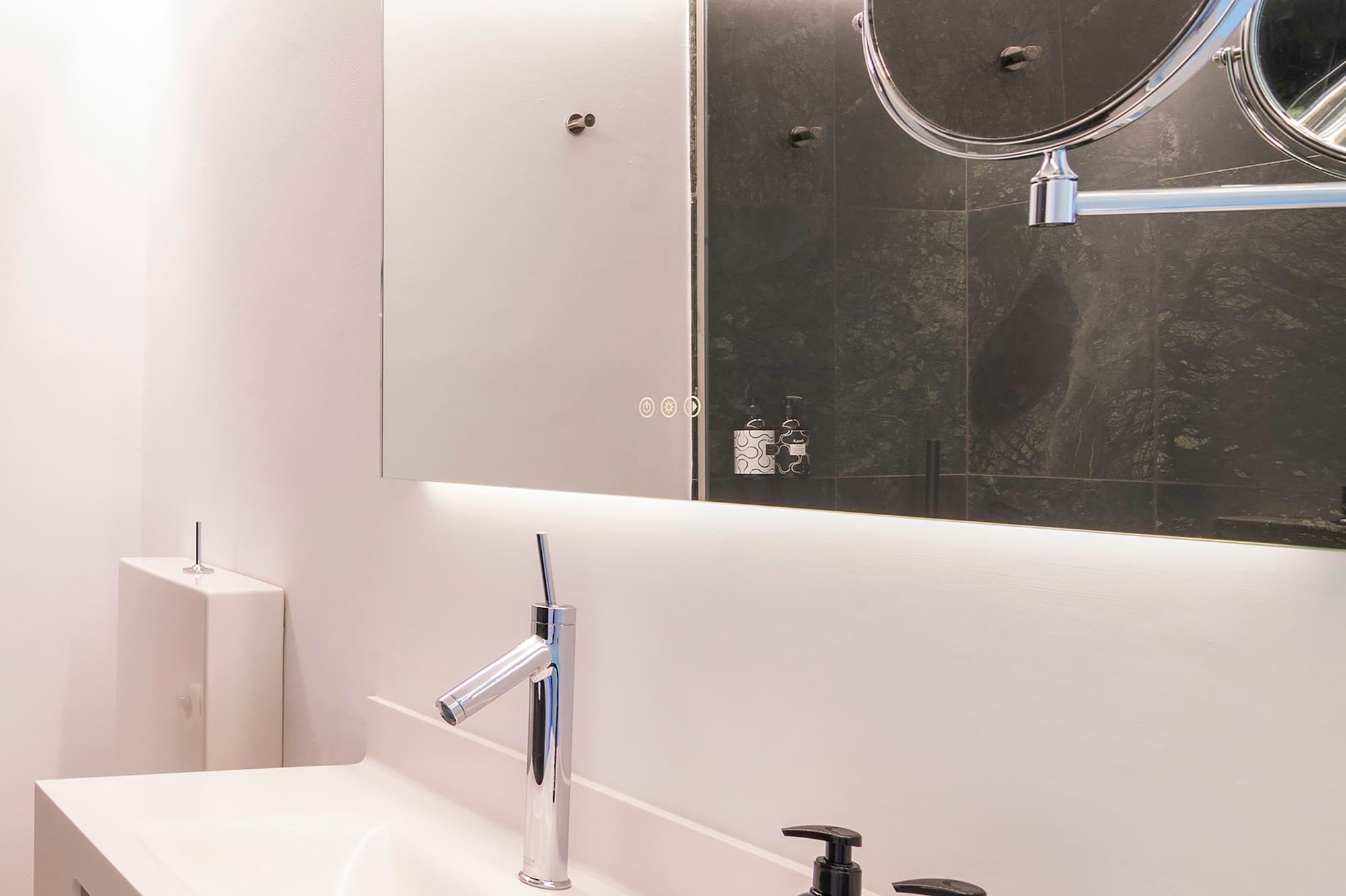 a bathroom with a mirror and a sink