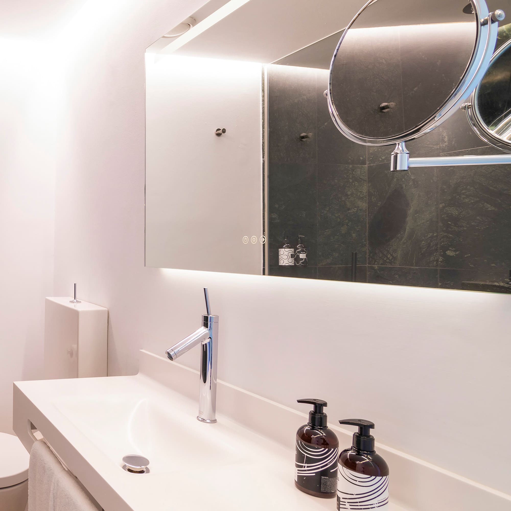 a bathroom with a mirror and a sink