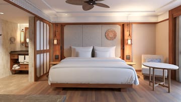 a bed with a fan in the middle