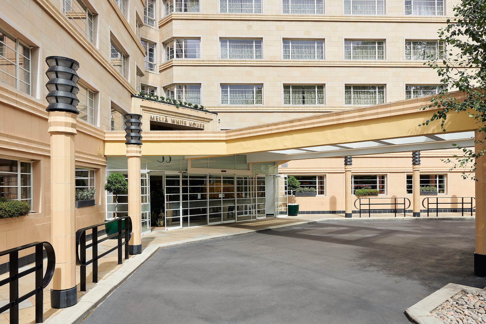 Melia White House hotel entrance, Art Deco style facade, covered driveway.