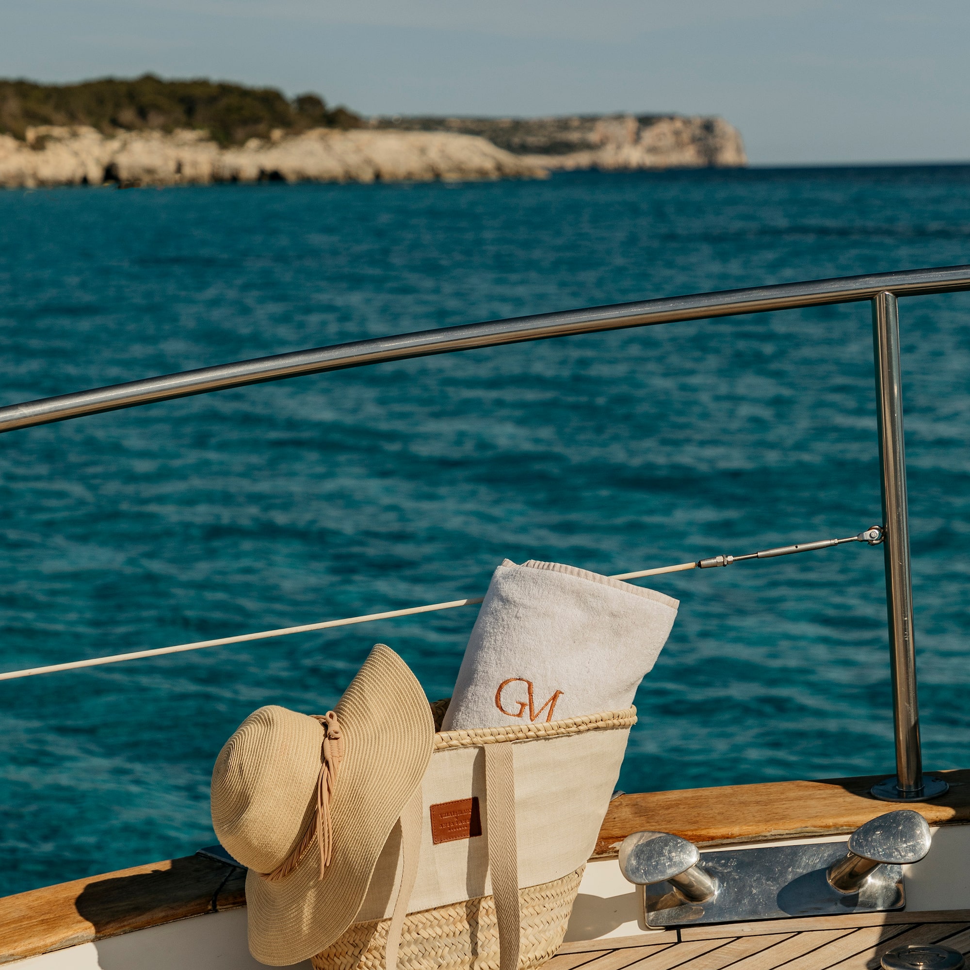 a hat and towel on a boat