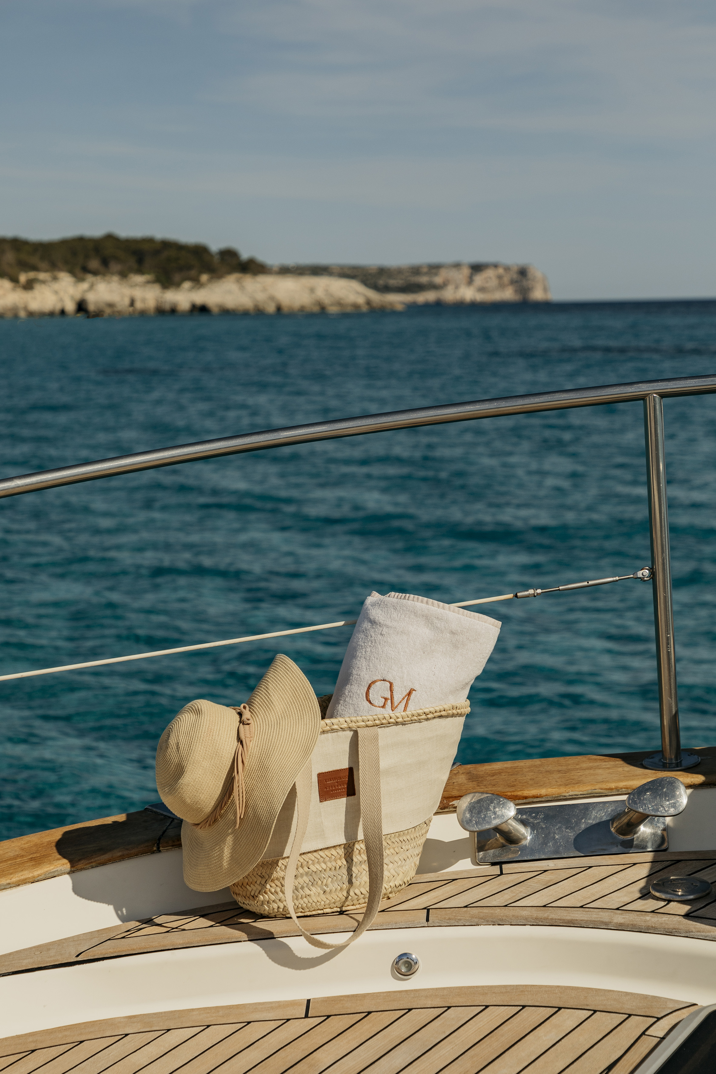 a hat and towel on a boat