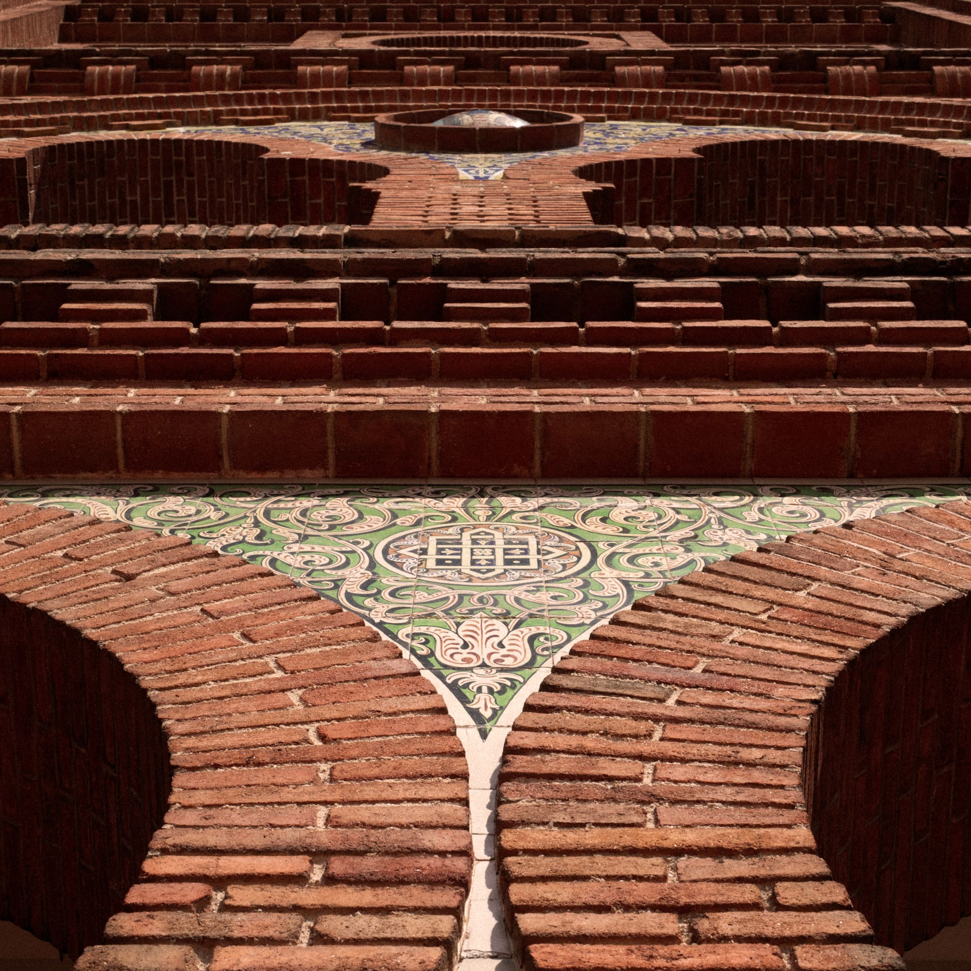 a brick wall with a circular pattern