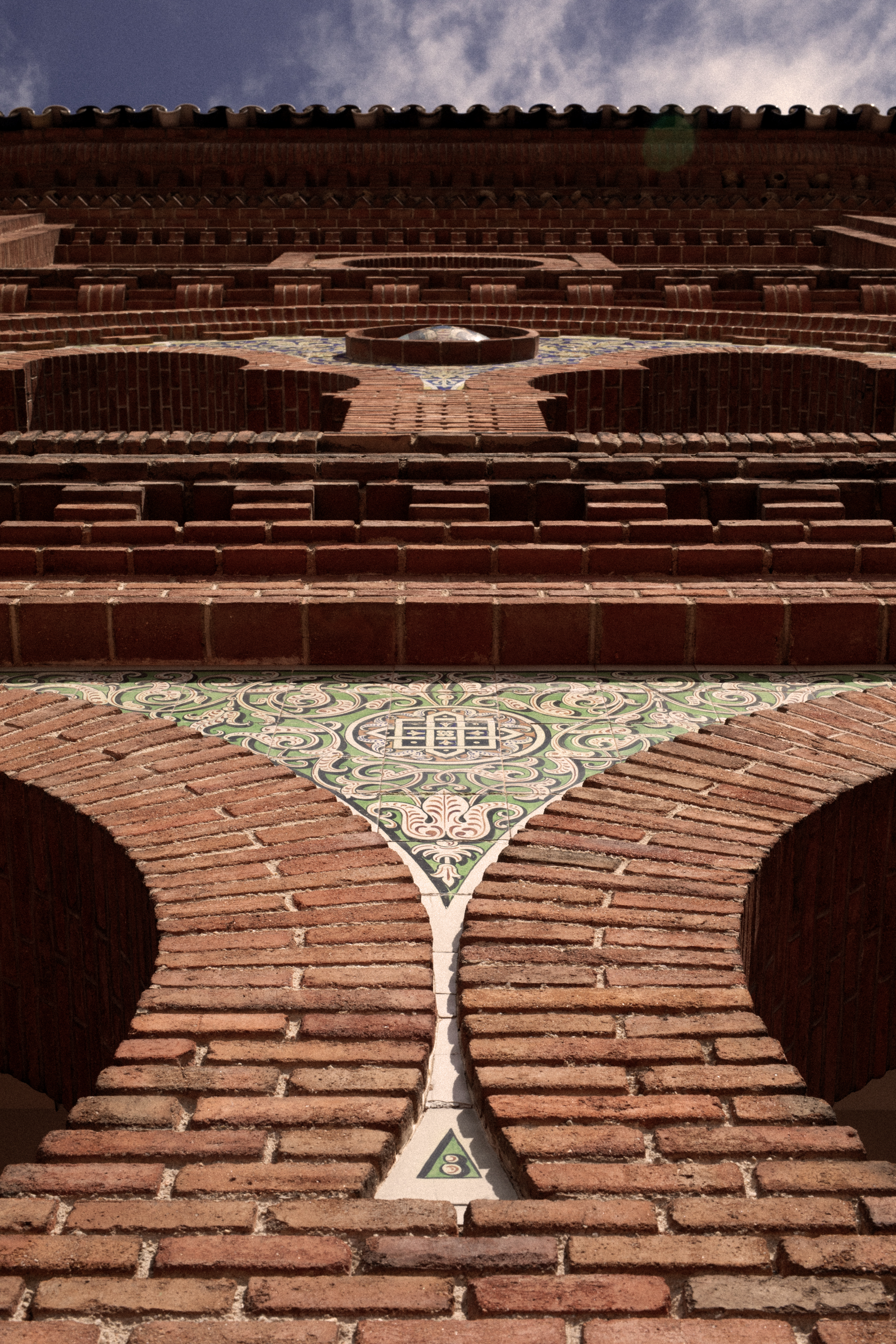 a brick wall with a circular pattern