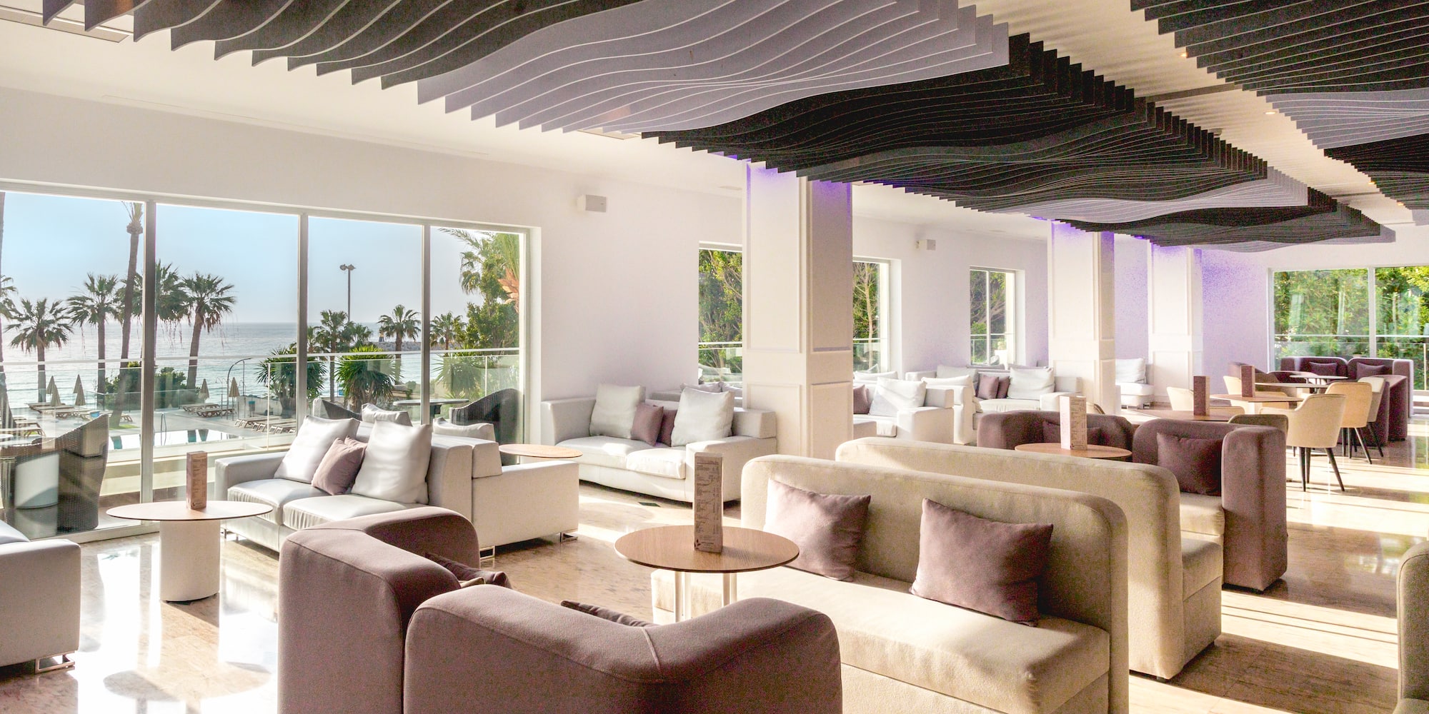 a room with couches and tables