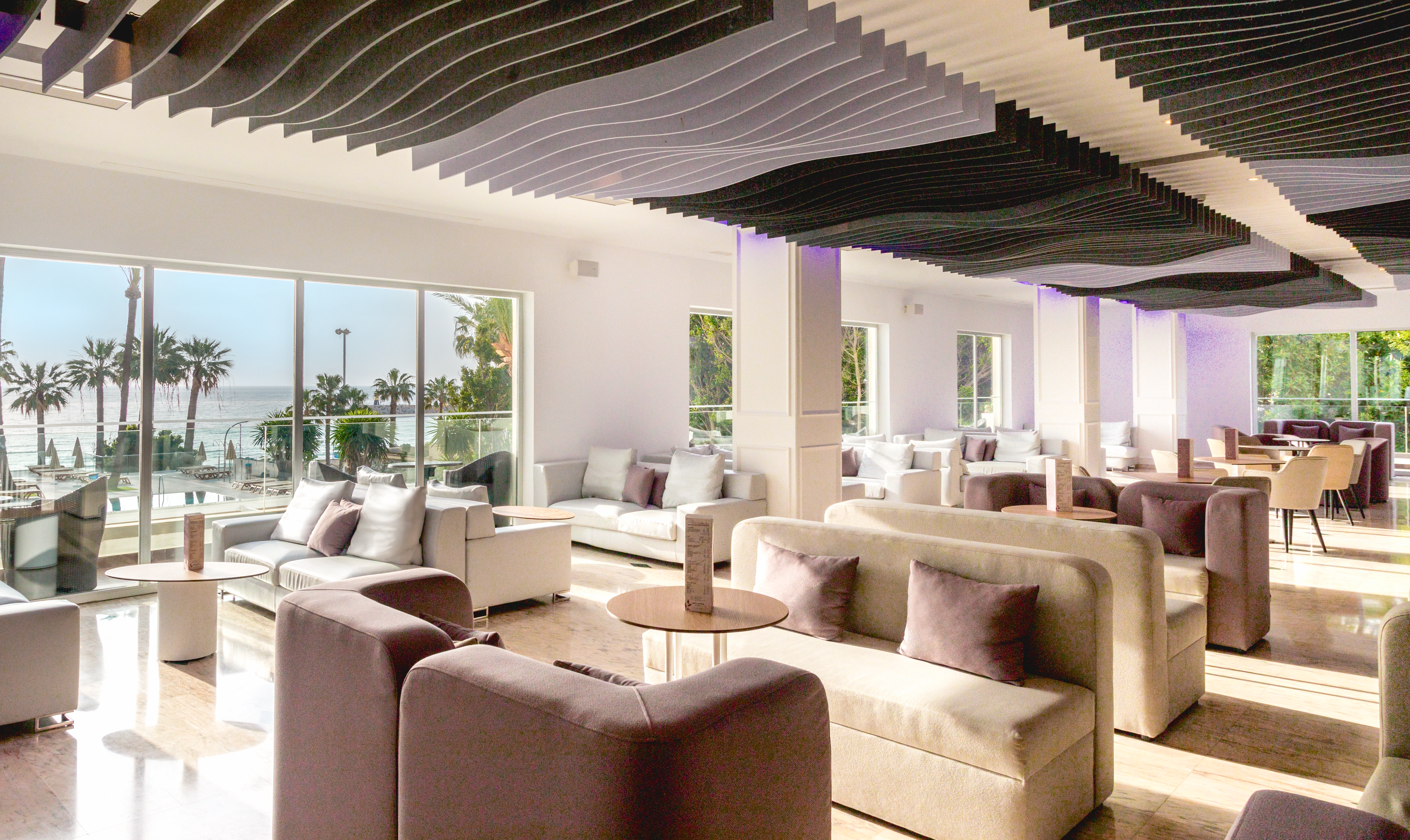 a room with couches and tables