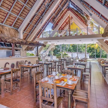a restaurant with tables and chairs