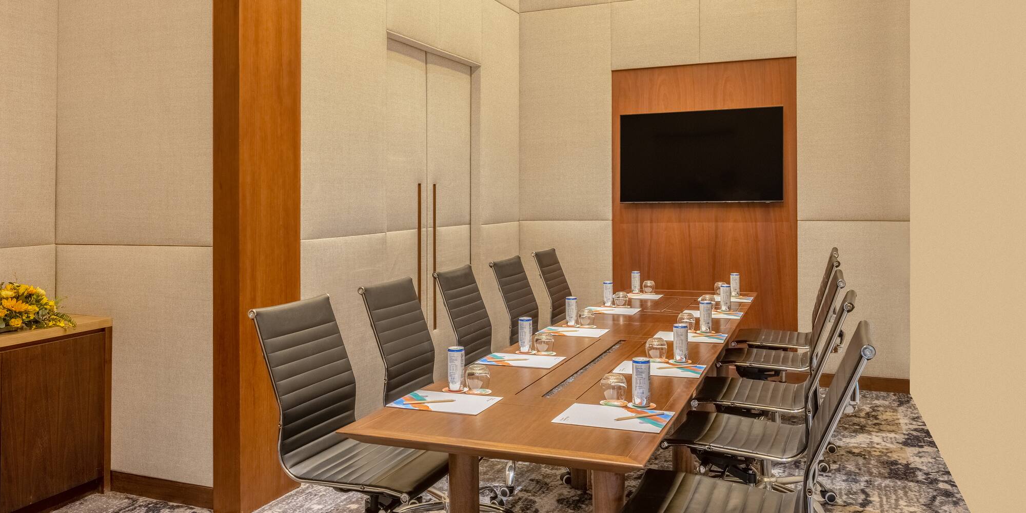 a conference room with a table and chairs