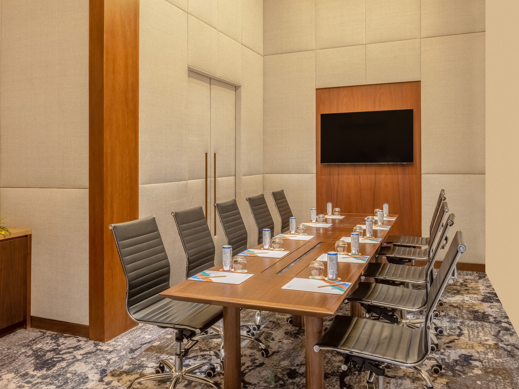 a conference room with a table and chairs