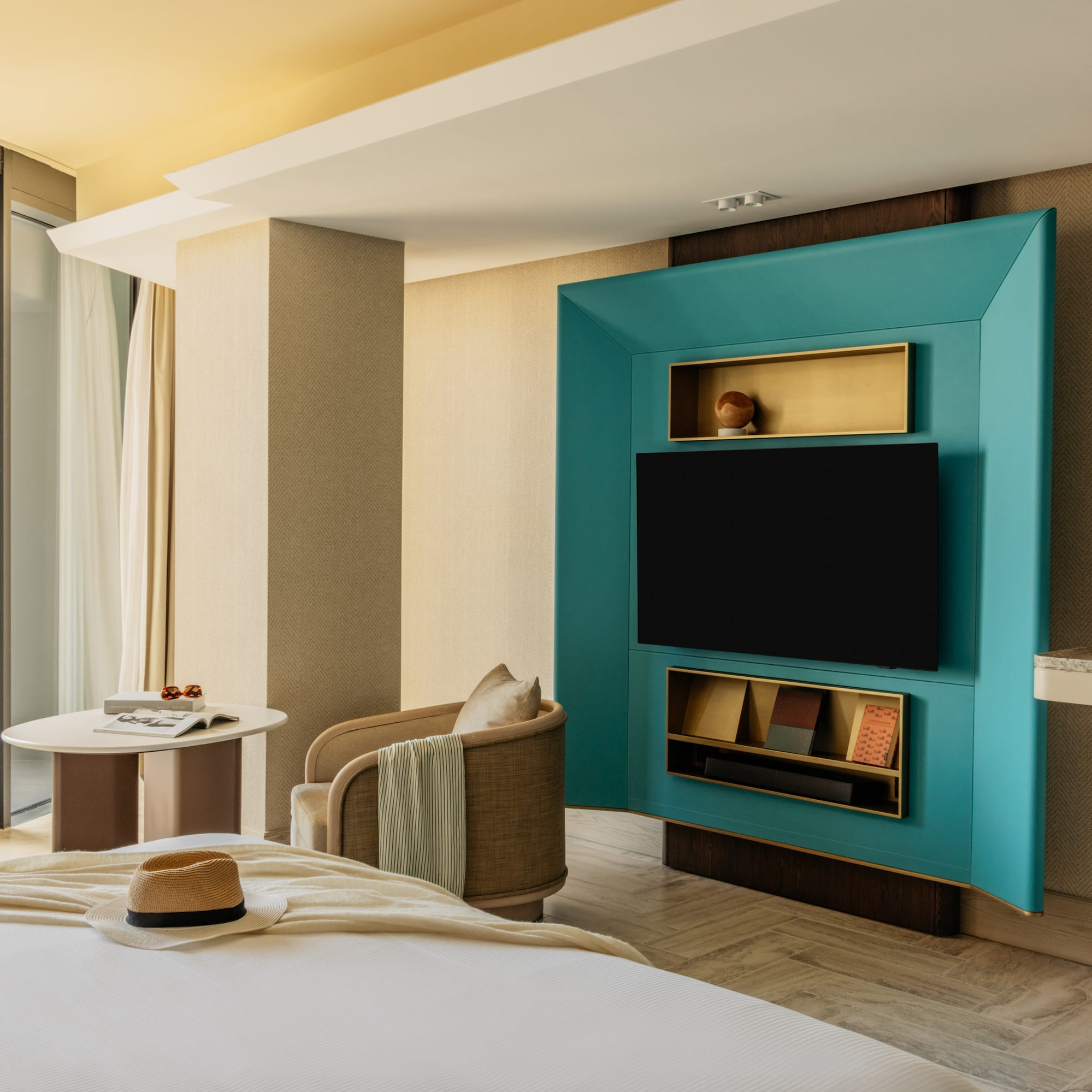 a room with a bed and a tv