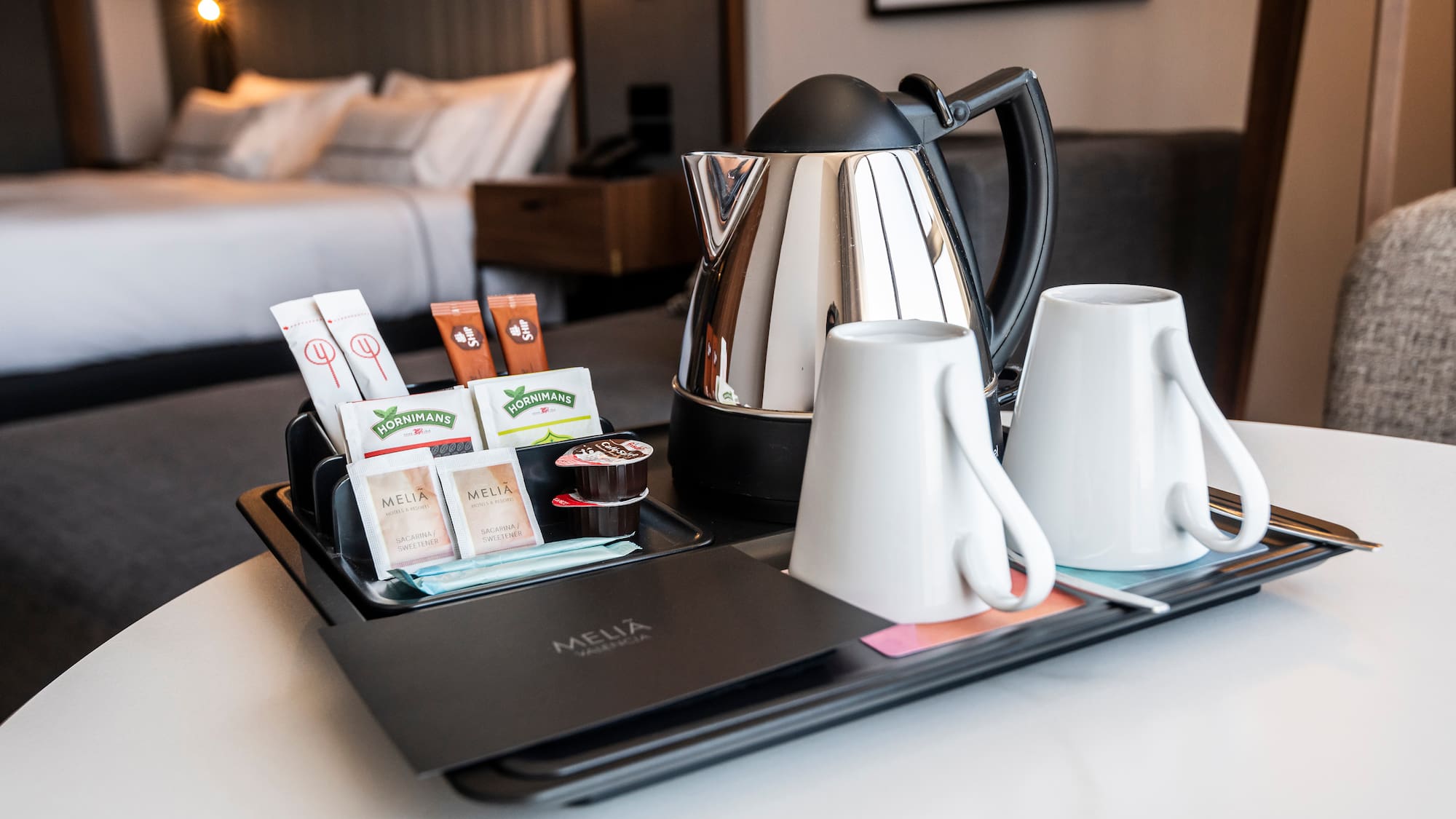 a tray with coffee and tea items on it