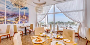 a table with food on it and a chandelier from the ceiling
