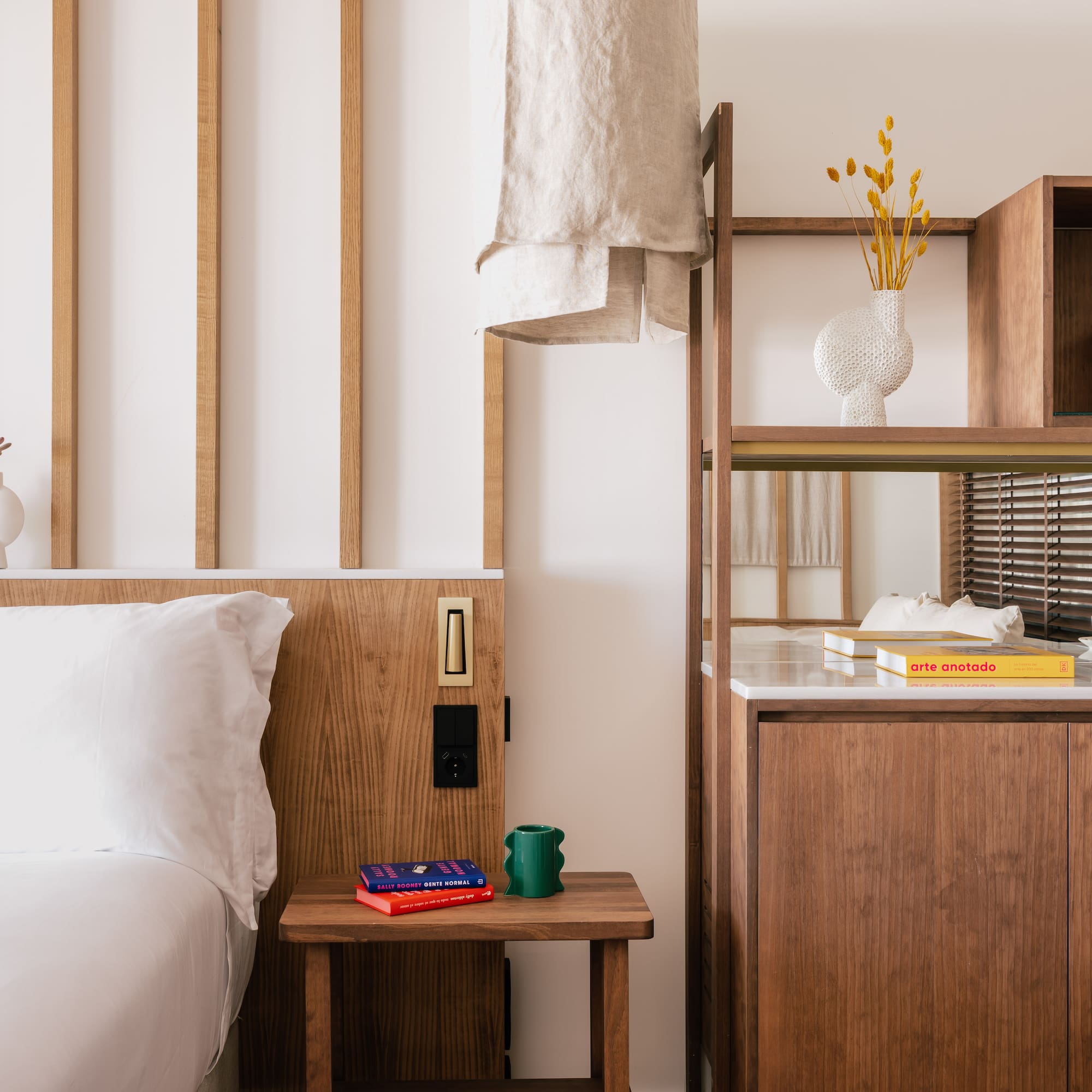 a bedroom with a bed and shelves