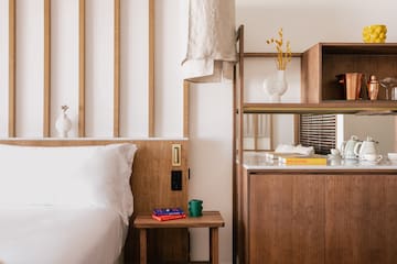 a bedroom with a bed and shelves