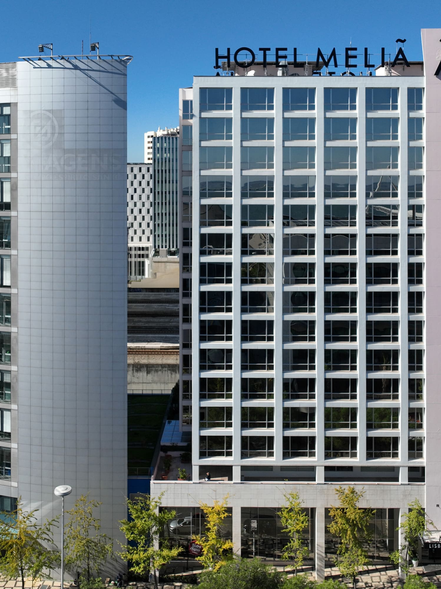 a group of buildings with glass windows