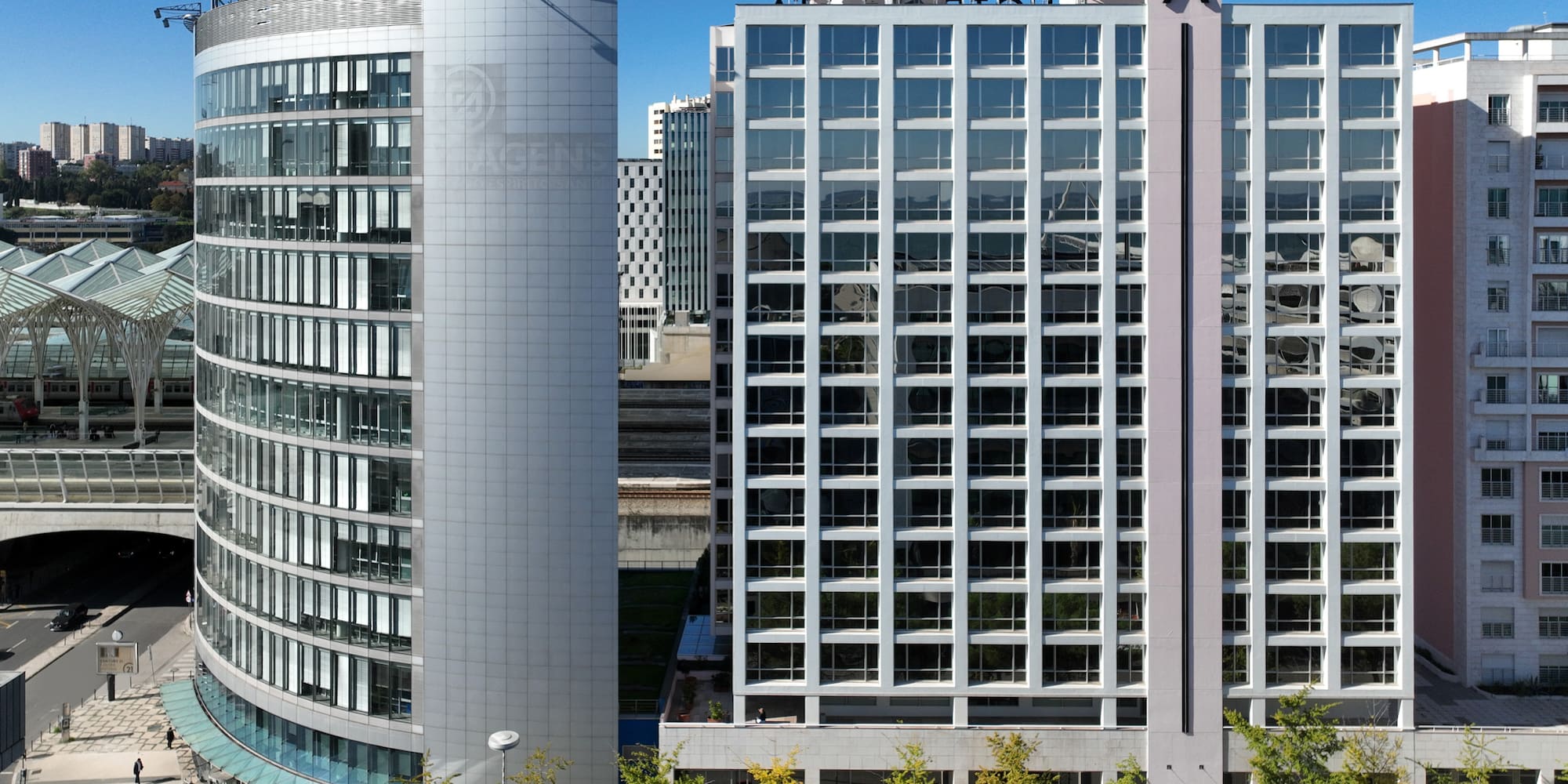 a group of buildings with glass windows