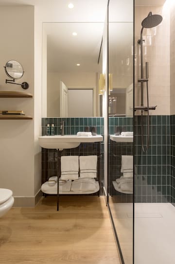 a bathroom with a shower and sink