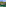 a body of water with trees and a hut