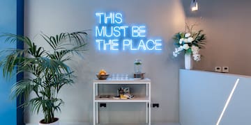 a room with a table and plants