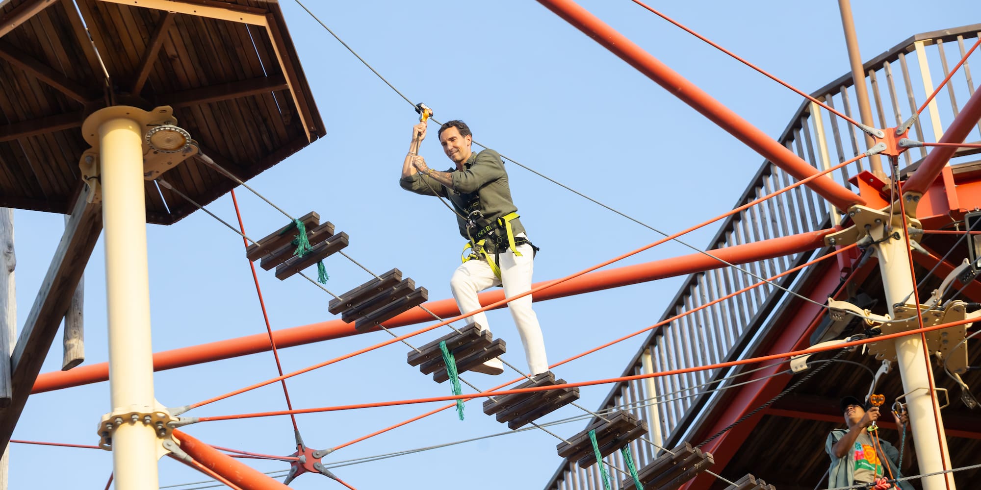 a man on a rope bridge